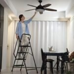 Four step lightweight folding ladder with wide anti slip pedal and safety handle - Image 5